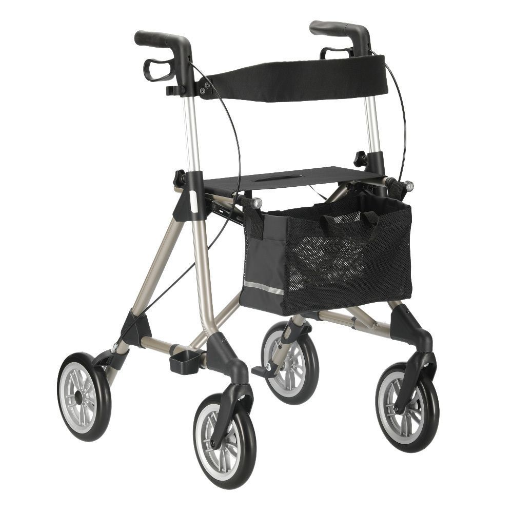 Rollator mit vier Rädern, champagnerfarbenem Rahmen, schwarzem Sitz und Korb. Griffe und Räder sind ebenfalls schwarz.