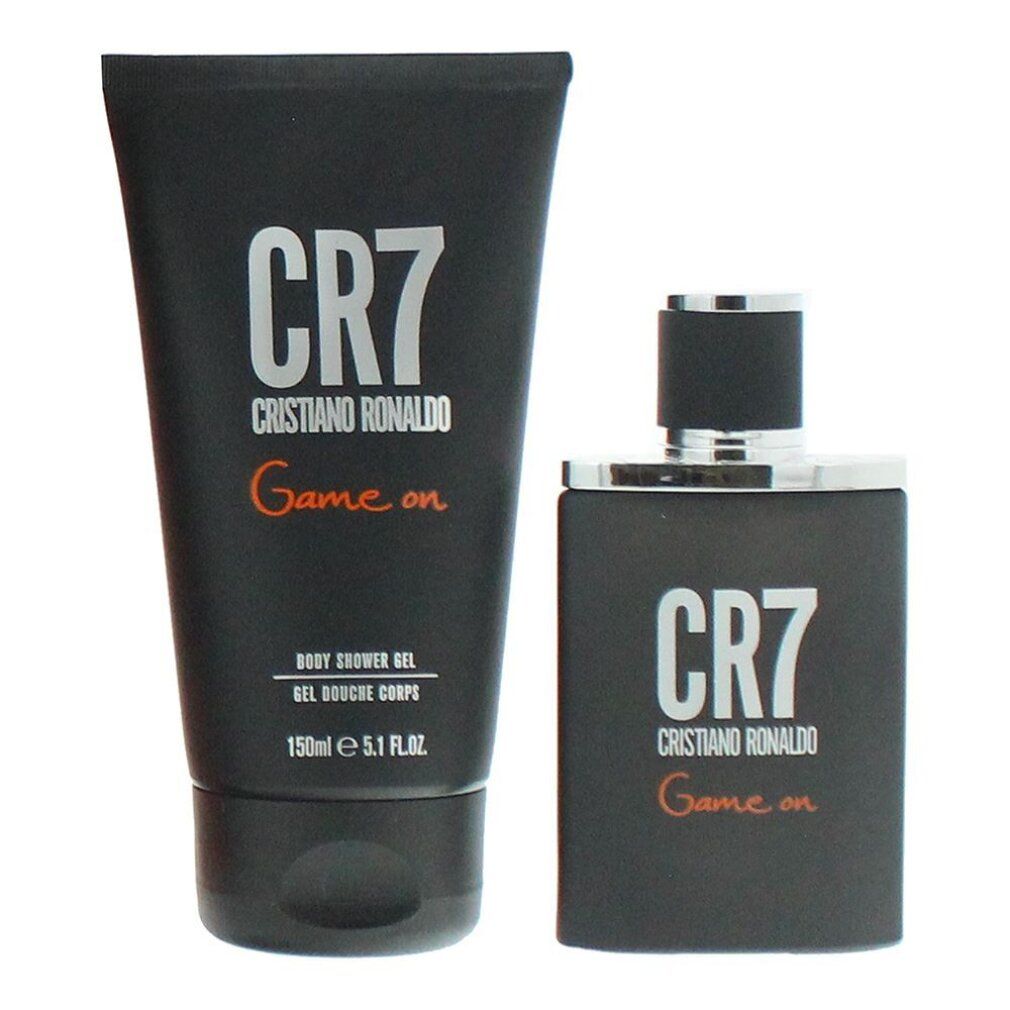 CR7 Duschgel und Duftflakon. Schwarze Flaschen mit weißer Schrift und orangefarbenem 'Game on'.