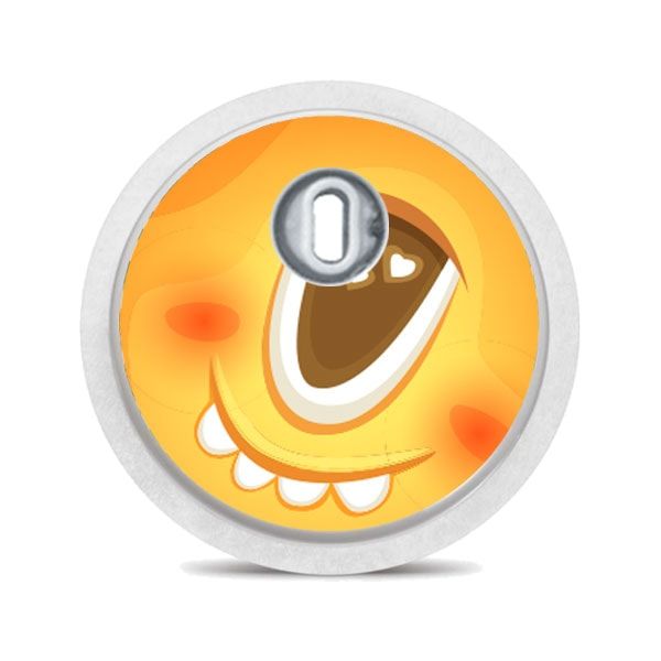 Runder Aufkleber mit gelbem Monstergesicht. Auge, Zähne, Wangen. Mit silbernem Applikator.