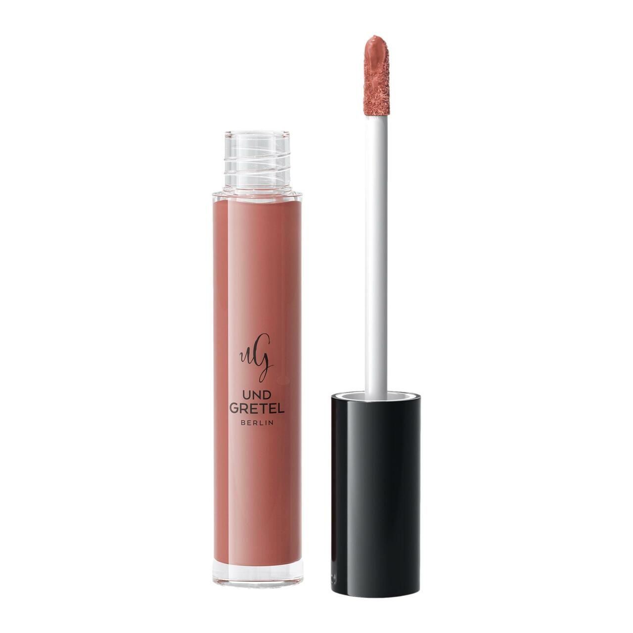 Flüssiger Lippenstift in einer transparenten Flasche mit schwarzem Deckel. Der Applikator ist sichtbar. Aufschrift: Und Gretel Berlin.