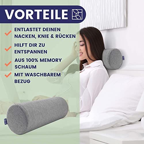 Graue Nackenrolle aus Memory-Schaum. Text: Entlastet Nacken, Knie & Rücken, hilft zu entspannen. Mit waschbarem Bezug.