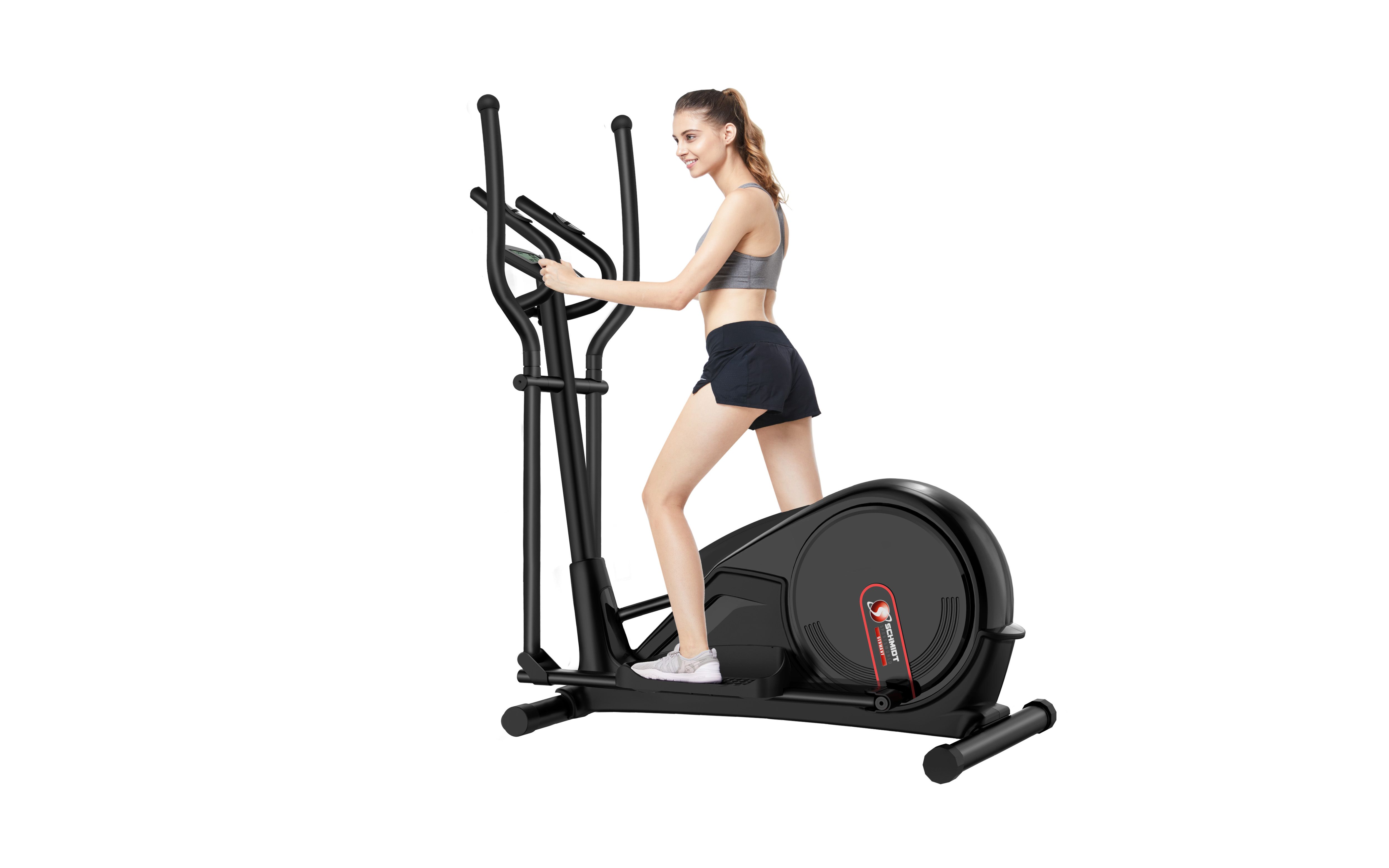 Frau trainiert auf einem schwarzen Crosstrainer. Sie trägt Sportkleidung. Vertikale Griffe, Pedale und rundes Schwungrad.