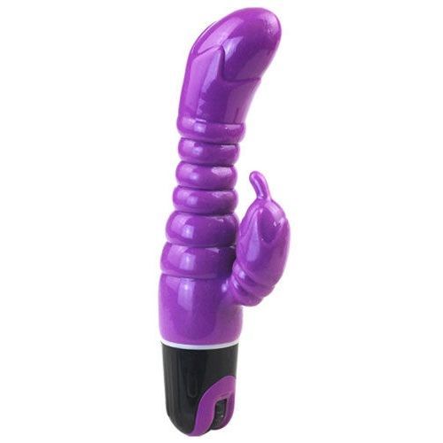Lila Vibrator mit geriffelter Oberfläche und gebogener Spitze. Schwarzer Sockel mit Schalter.