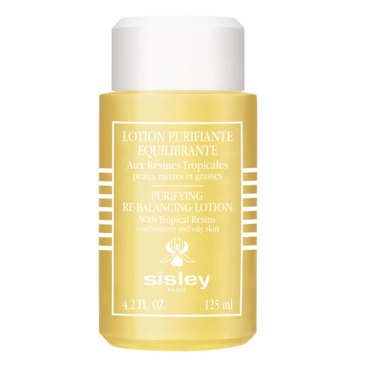 Gelbe Flasche mit weißem Deckel. Beschriftung: Lotion Purifiante Equilibrante, Sisley. Volumen: 125 ml.