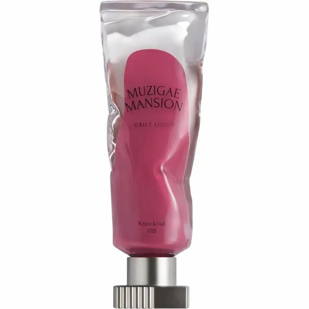Lippentint in transparenter Verpackung. Rosa Farbe. Text: MUZIGAE MANSION Objet Liquid, Knockout 018.