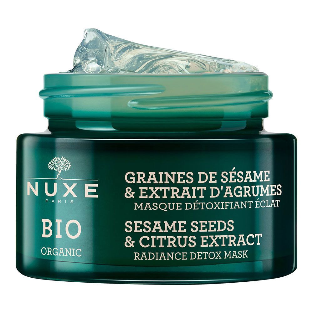 Grüner Tiegel mit NUXE BIO-Gesichtsmaske. Text: GRAINES DE SÉSAME & EXTRAIT D'AGRUMES, MASQUE DÉTOXIFIANT ÉCLAT, SESAME SEEDS & CITRUS EXTRACT, RADIANCE DETOX MASK.