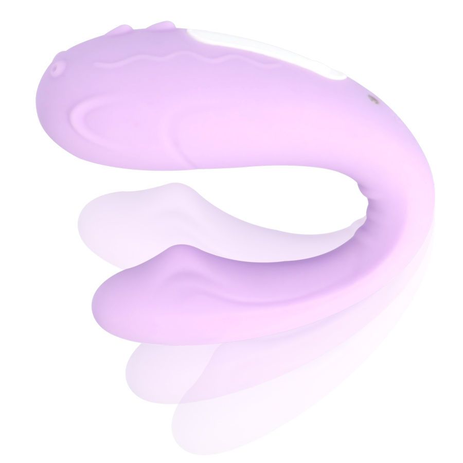 Lila Vibrator in geschwungener Form. Oberseite mit wellenförmigen Details und weißem Bereich. Zwei Knöpfe.