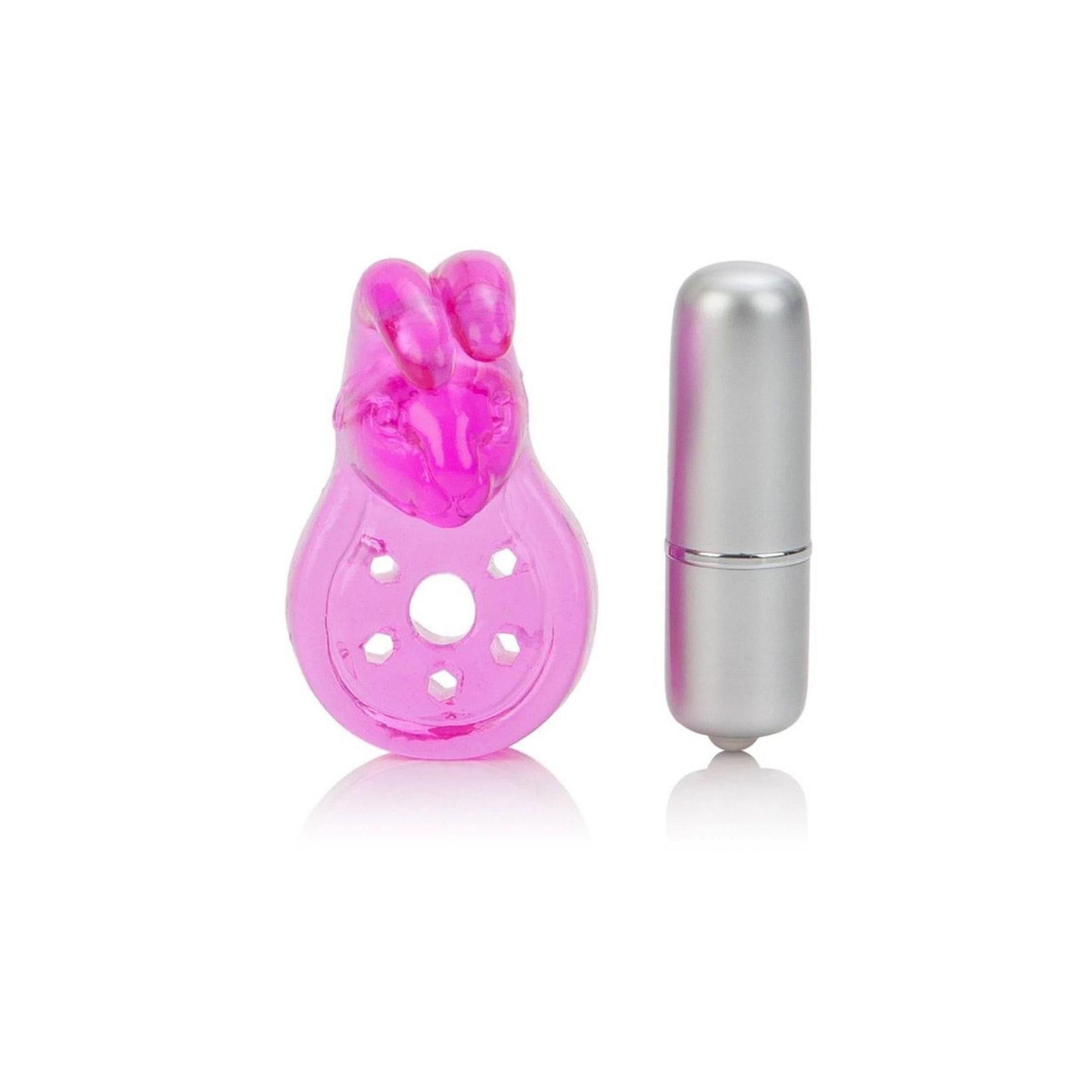 Rosa Vibrator mit Hasenohren und silbernem Zylinder. Der Zylinder liegt neben dem Vibrator. Der Vibrator hat eine runde Form mit Löchern.