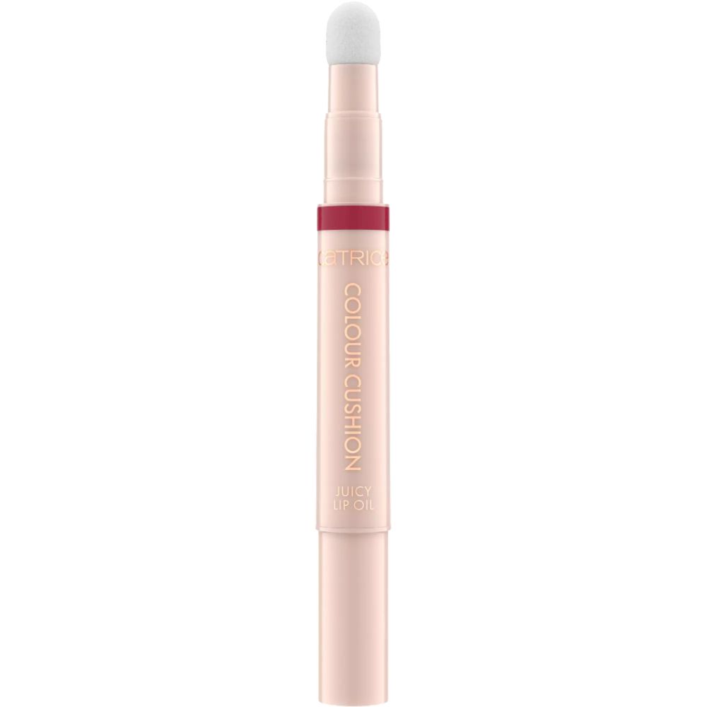 Ein heller, rosafarbener Lippenölstift mit Applikator. Beschriftung: 'COLOUR CUSHION JUICY LIP OIL'.