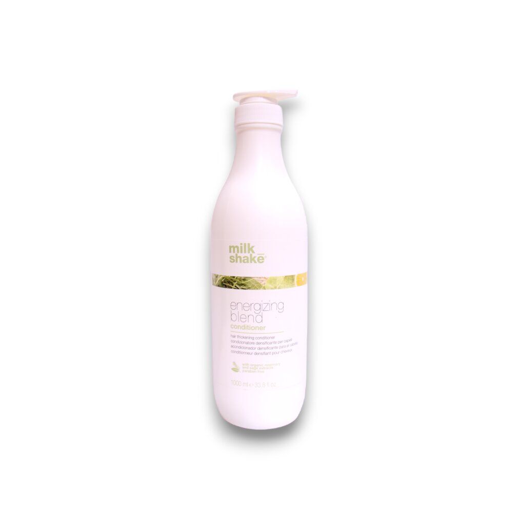 Weiße Flasche mit Pumpverschluss. Aufschrift: Milk_Shake, energizing blend conditioner. Grün-gelbes Etikett.