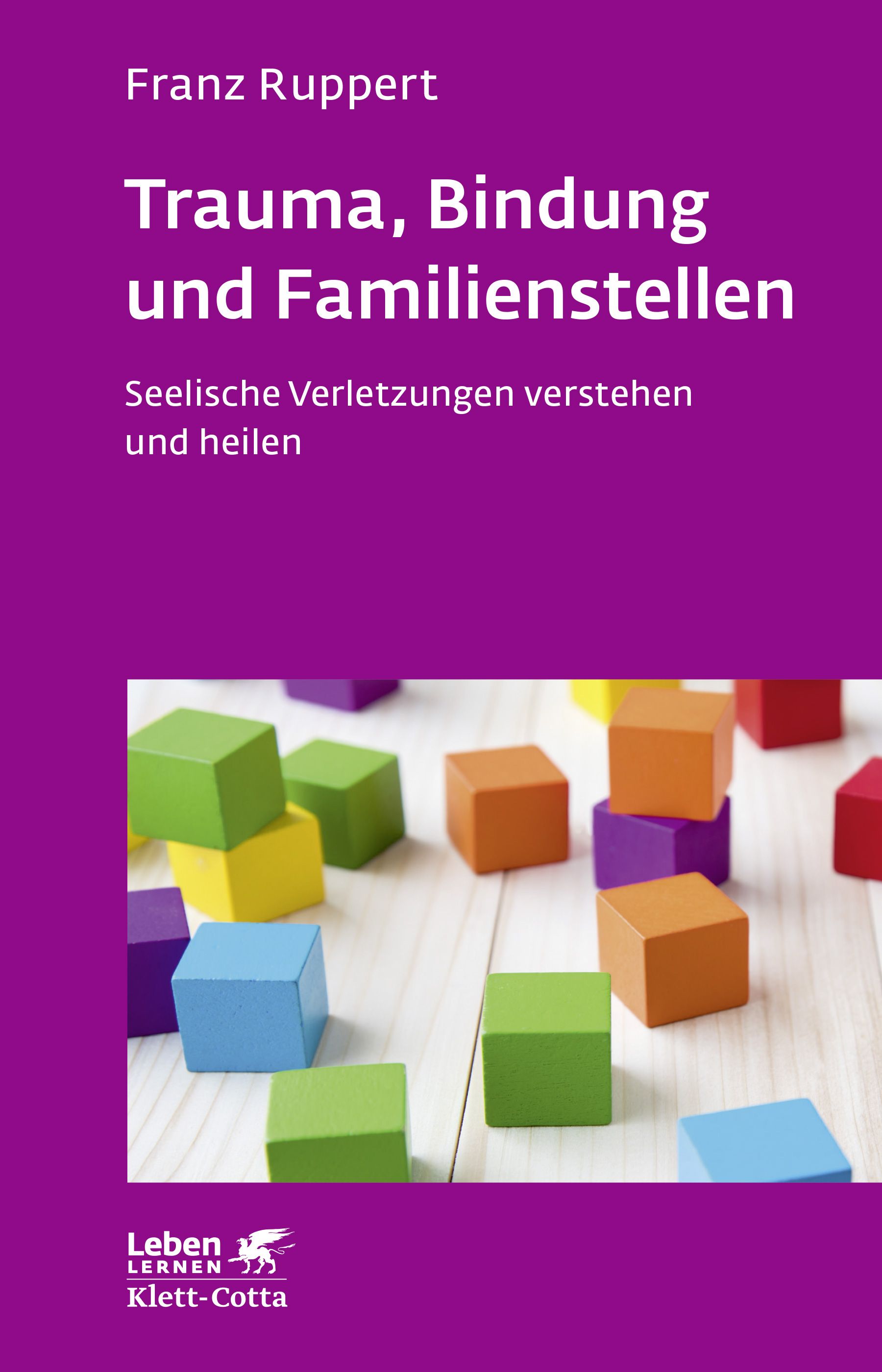 Buchcover mit Titel: Trauma, Bindung und Familienstellen. Autor: Franz Ruppert. Auf violettem Hintergrund, farbige Holzbausteine.