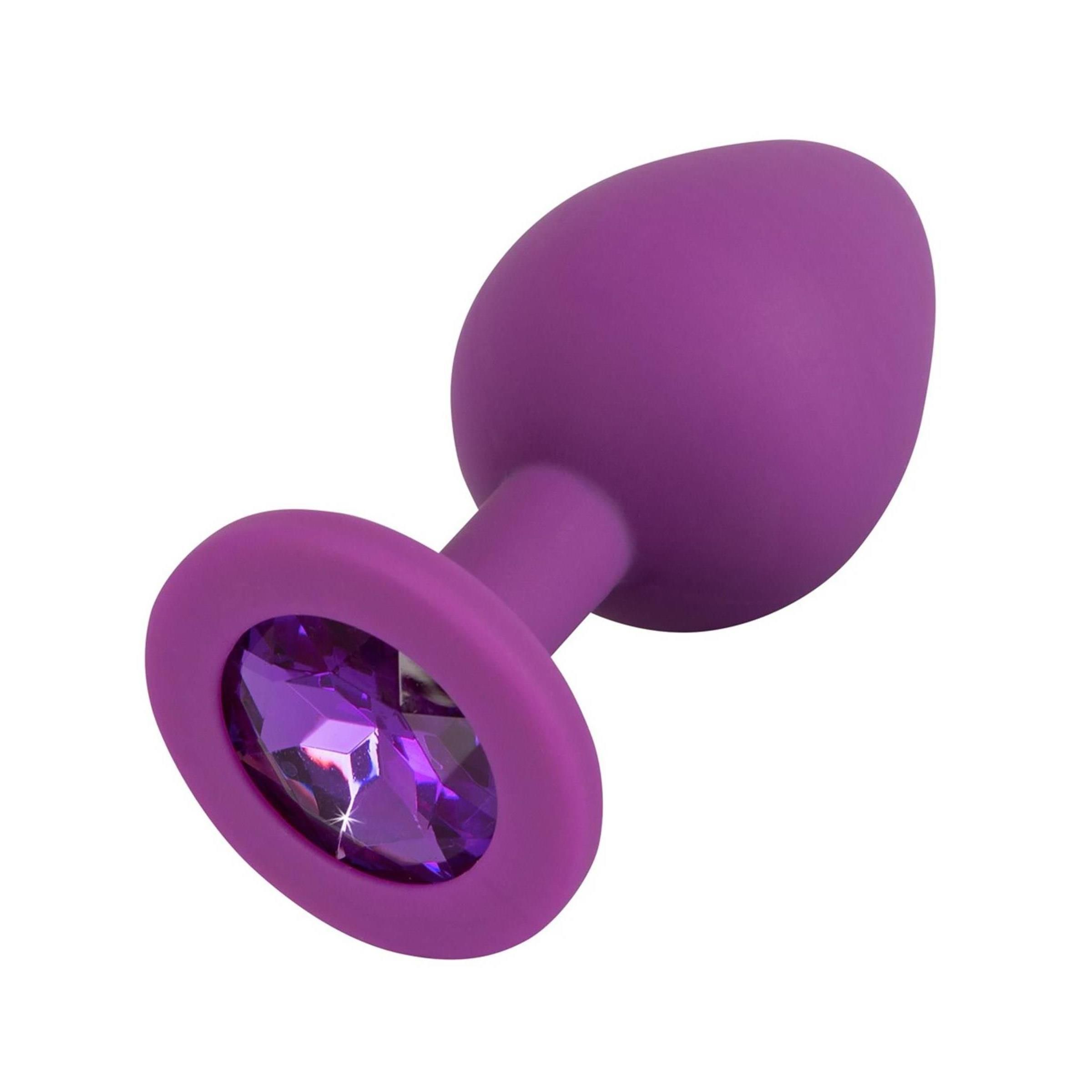 Lila Plug mit lila Schmuckstein. Runde Basis, konische Form. Perspektivische Ansicht.