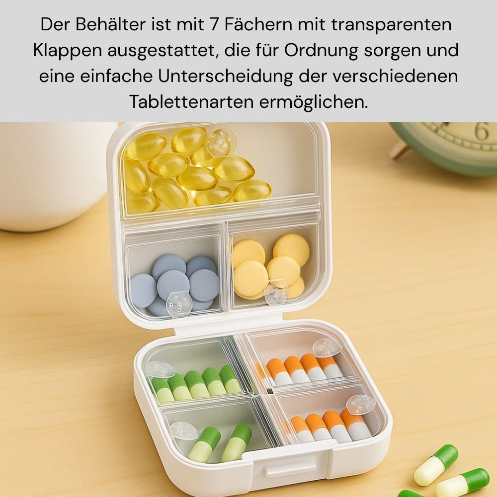 Geöffnete, weiße Tablettenbox mit 7 Fächern. Enthält verschiedene Tabletten und Kapseln. Transparente Deckel.