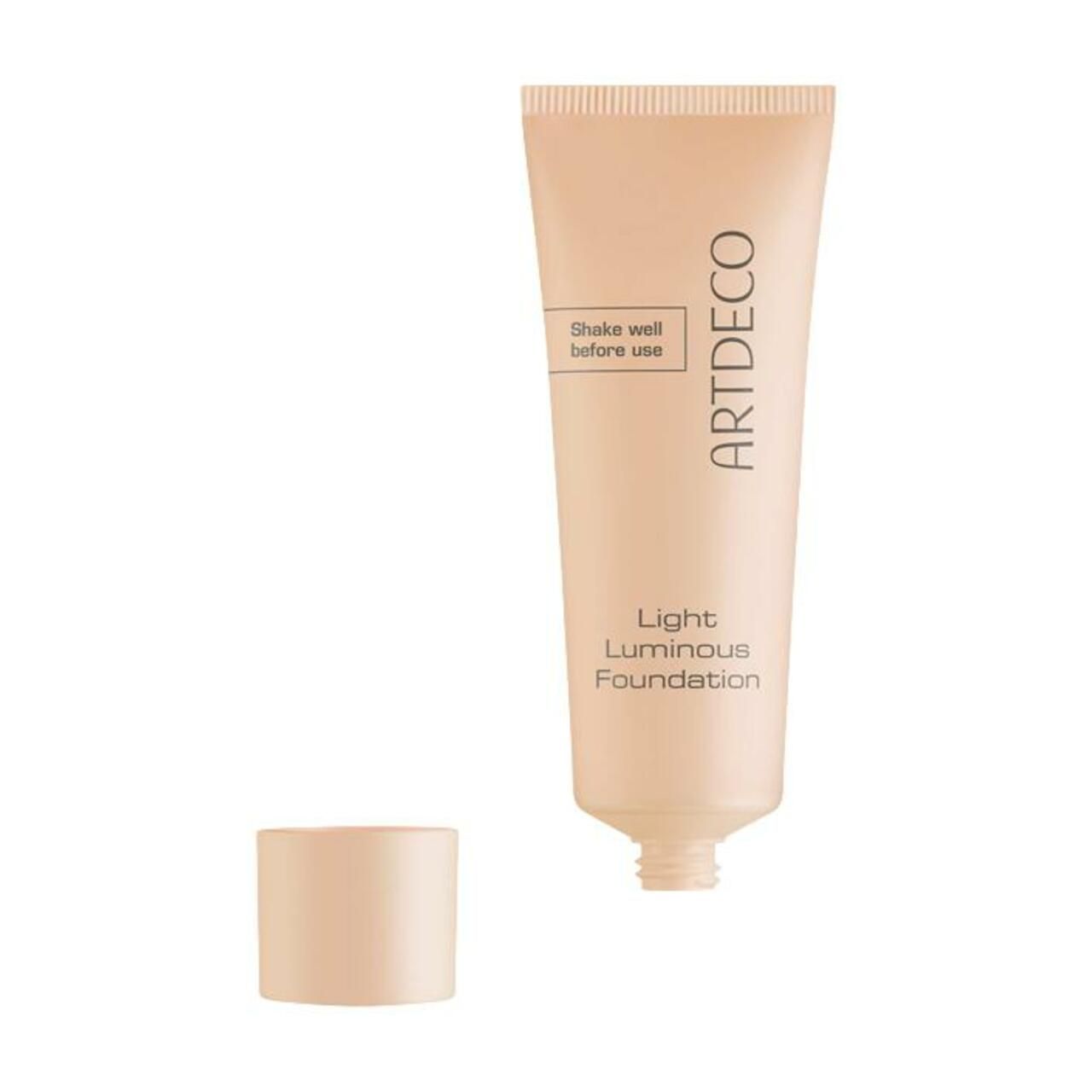 Beigefarbene Tube mit "ARTDECO"-Schriftzug. Darunter "Light Luminous Foundation". Deckel daneben.
