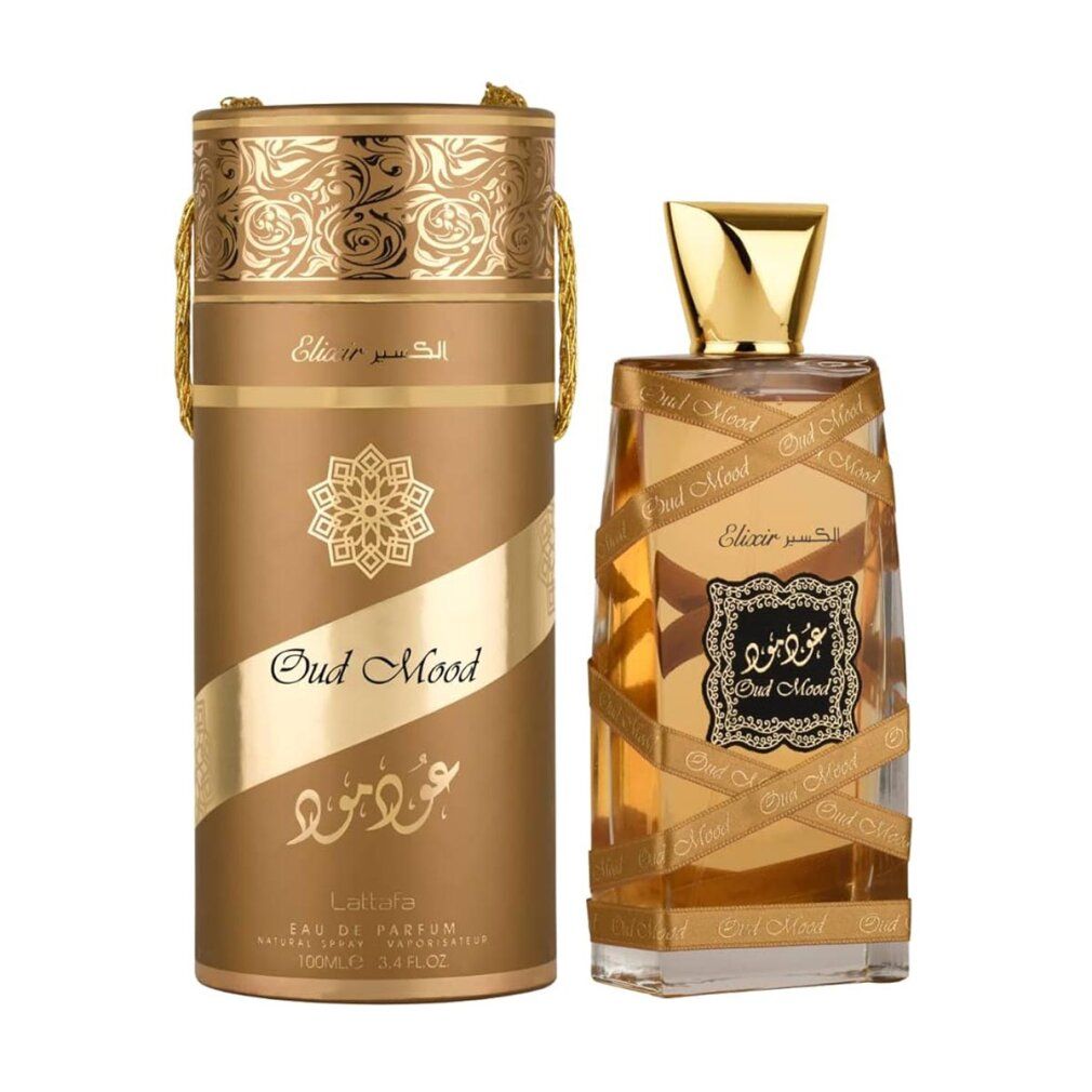 Parfümflasche und zylindrische Verpackung. Goldfarben, arabische Schrift. Flasche mit goldener Kappe und brauner Flüssigkeit.