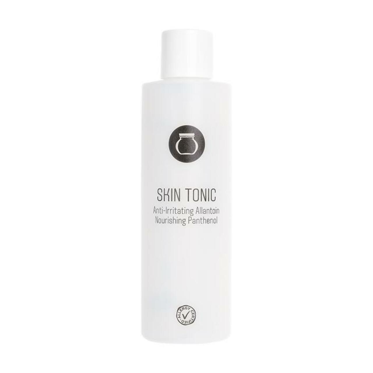 Haut-Tonic-Flasche mit weißem Deckel. Aufschrift: Skin Tonic, Anti-irritating Allantoin, Nourishing Panthenol. Logo.
