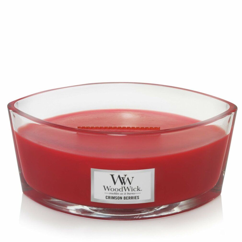 Rote Kerze in elliptischer Glasform. Etikett mit 'Crimson Berries'. Holzdocht sichtbar.