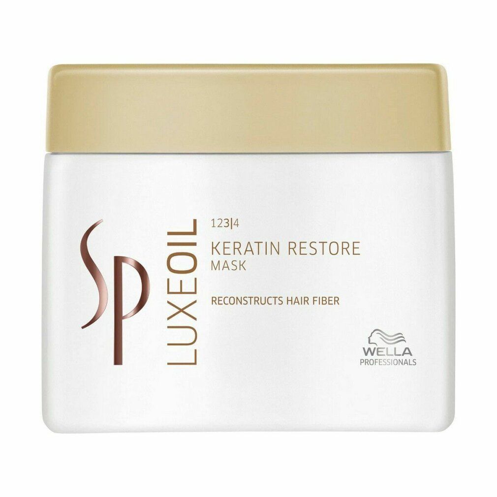 Weißer Tiegel mit goldfarbenem Deckel. Aufschrift: Luxeoil Keratin Restore Mask. Wella Professionals Logo.