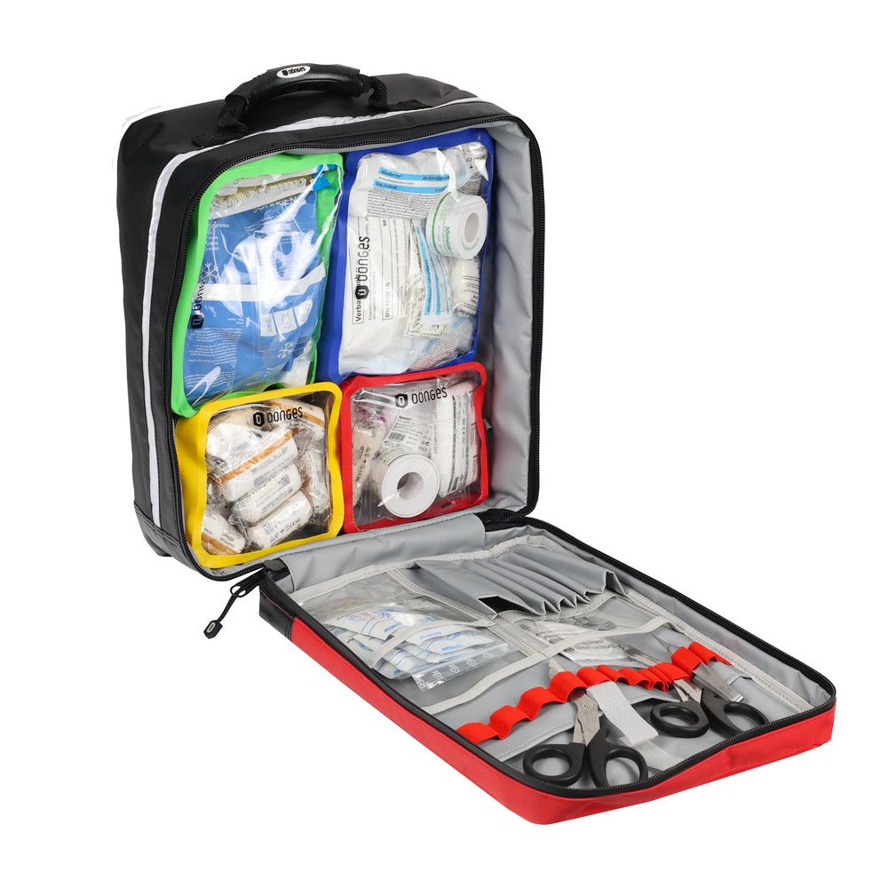 Notfallrucksack, offen, mit farbigen Innentaschen. Enthält Verbandsmaterial und Instrumente. Schwarzer Griff oben.