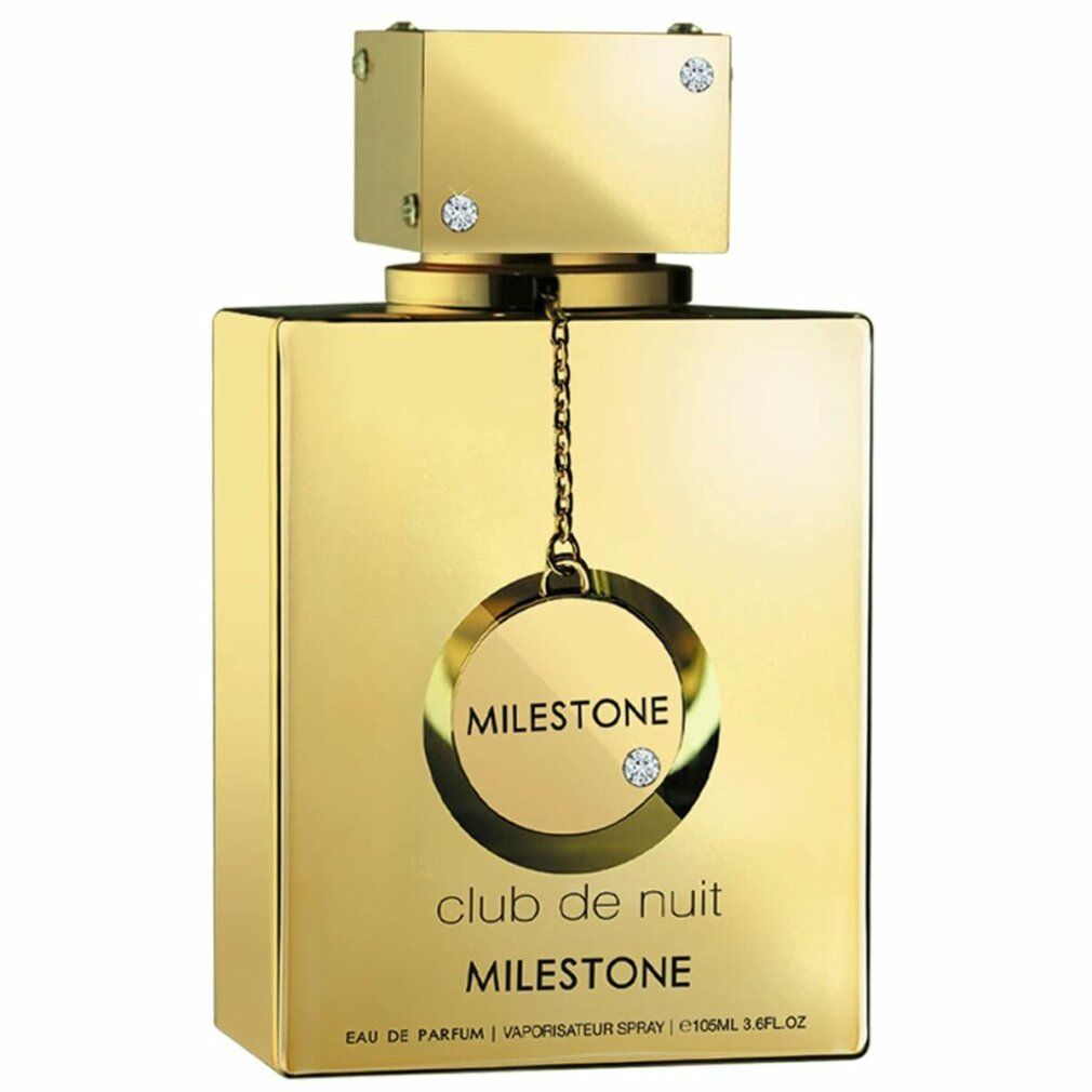 Goldfarbener Flakon mit quadratischer Form. Aufschrift 'Club de Nuit Milestone'. Flakon mit Anhänger und Schmucksteinen.