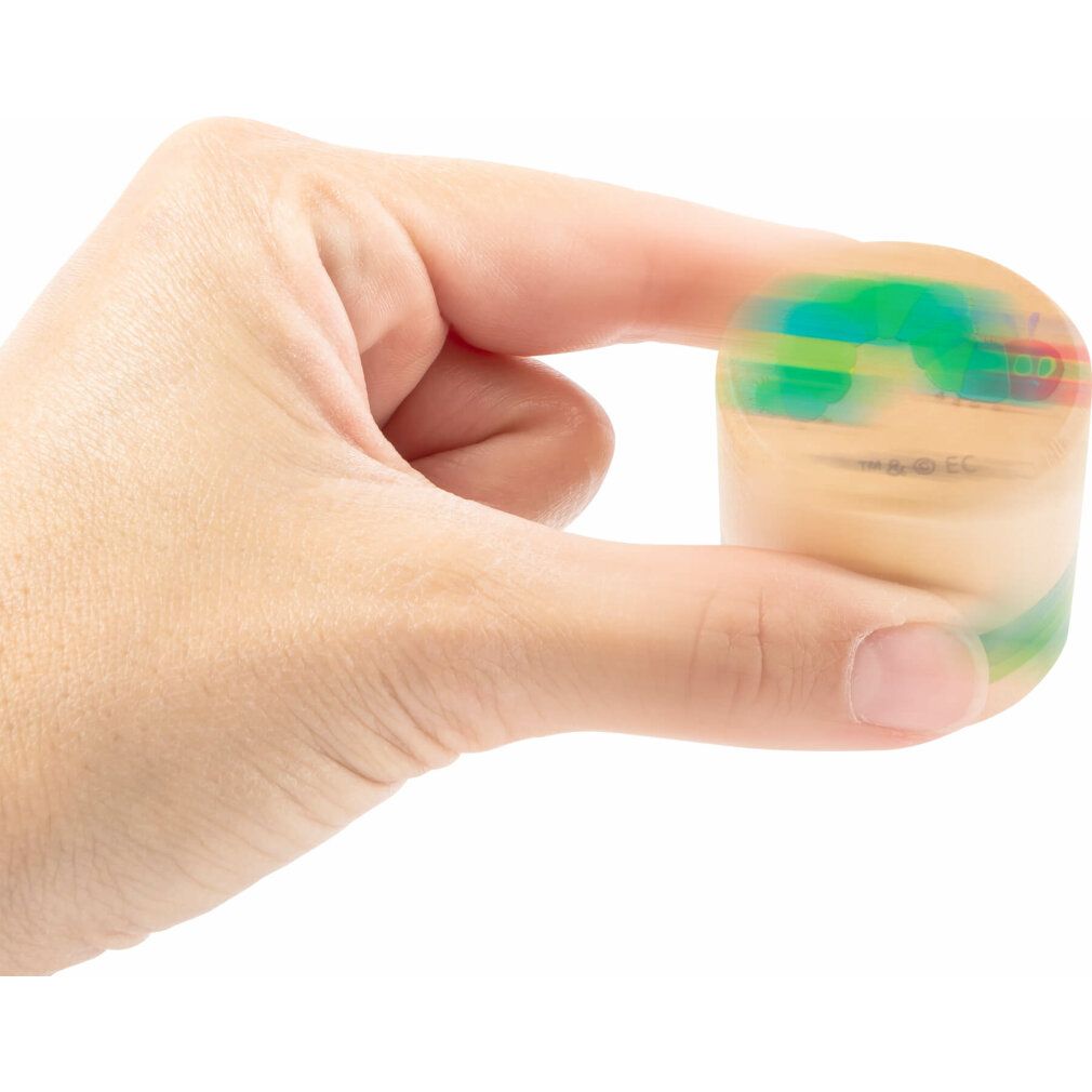 Ein Holzzylinder mit farbigen Streifen, gehalten in einer Hand. Der Zylinder ist unscharf.