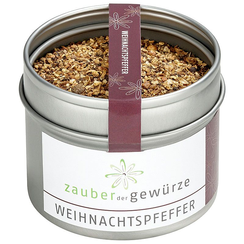Runde Dose mit Weihnachtspfeffer. Weißes Etikett mit Schriftzug. Lila Band mit Produktname. Gewürze sichtbar.