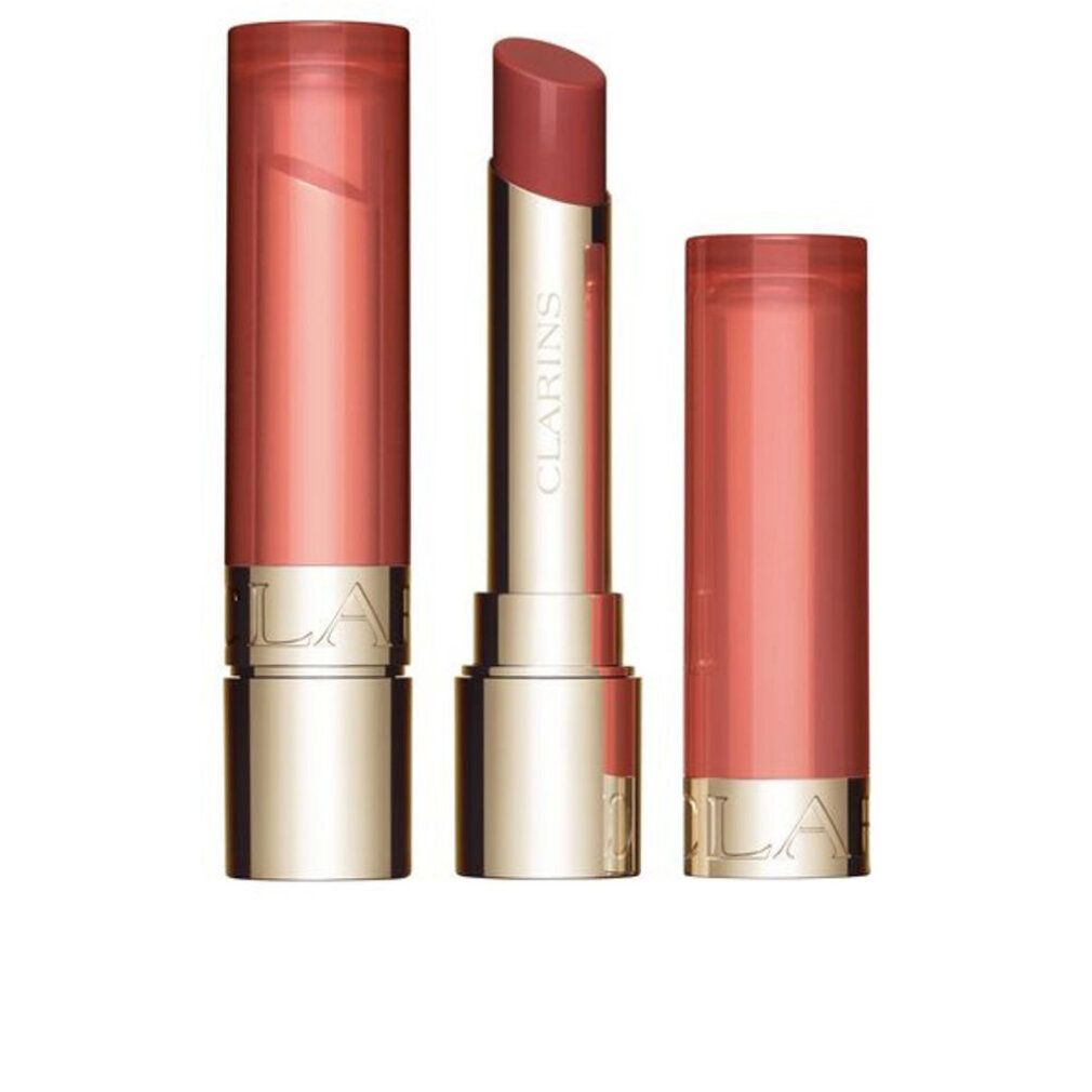 Lippenbalsam, geöffnet und geschlossen. Goldfarbener Behälter mit rosafarbenem Lippenstift. Marke Clarins sichtbar.