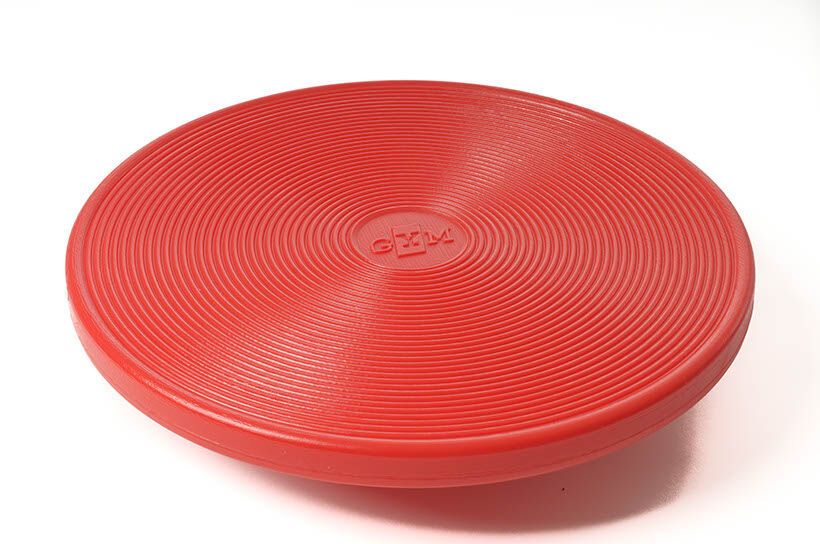 Roter Therapiekreisel mit konzentrischen Rillen. Logo in der Mitte.