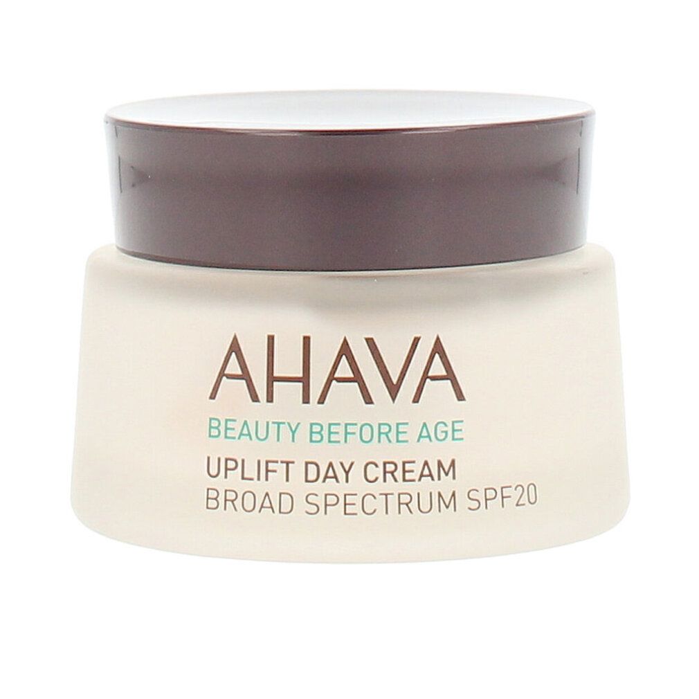 Cremebehälter mit braunem Deckel. Aufschrift: AHAVA, BEAUTY BEFORE AGE, UPLIFT DAY CREAM, BROAD SPECTRUM SPF20.