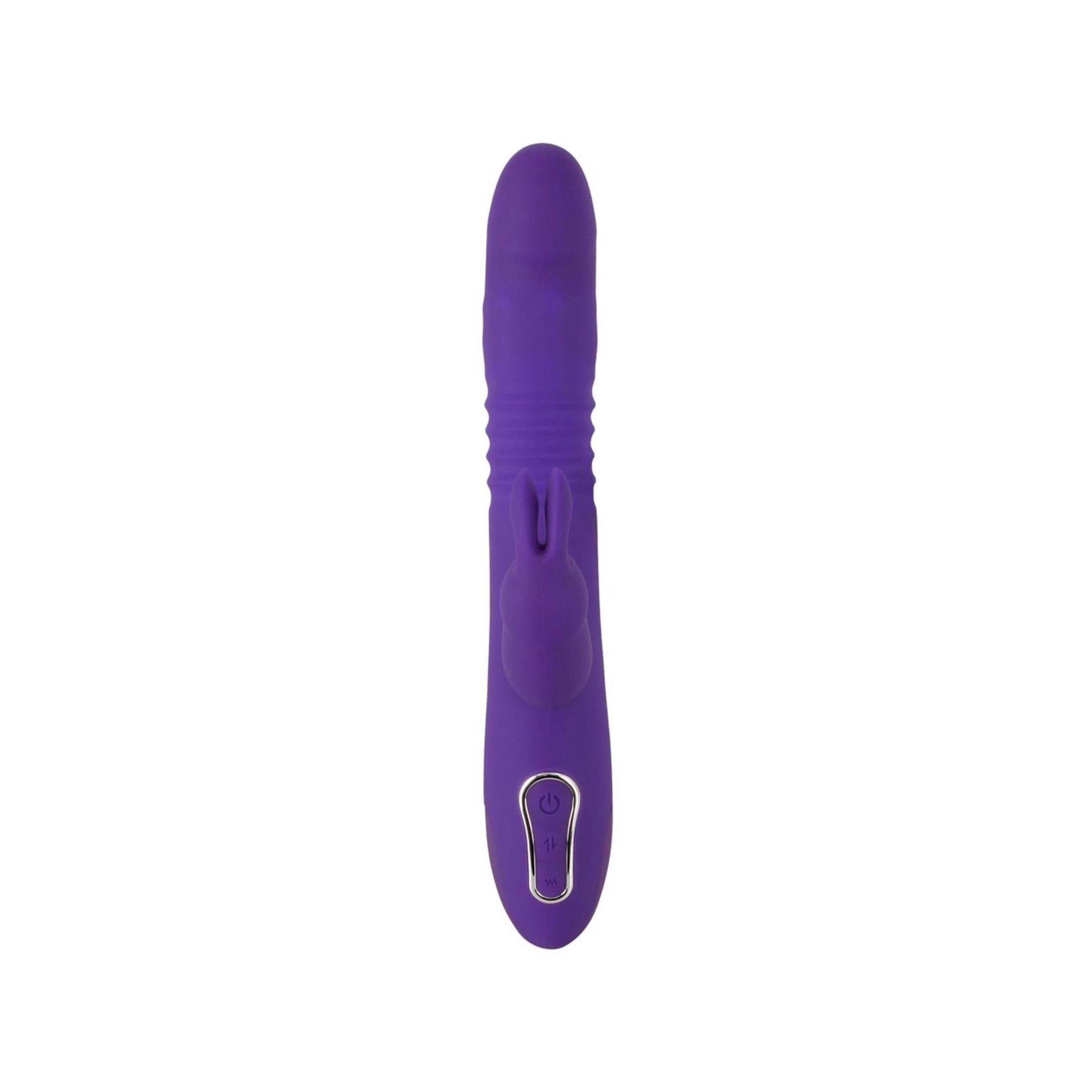 Lila Vibrator mit geriffelter Oberfläche und Knopf. Auf weißem Hintergrund.