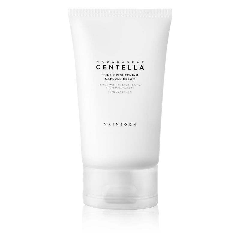 Tubo bianco con scritta: MADAGASCAR CENTELLA Tone Brightening Capsule Cream. Marchio SKIN1004.