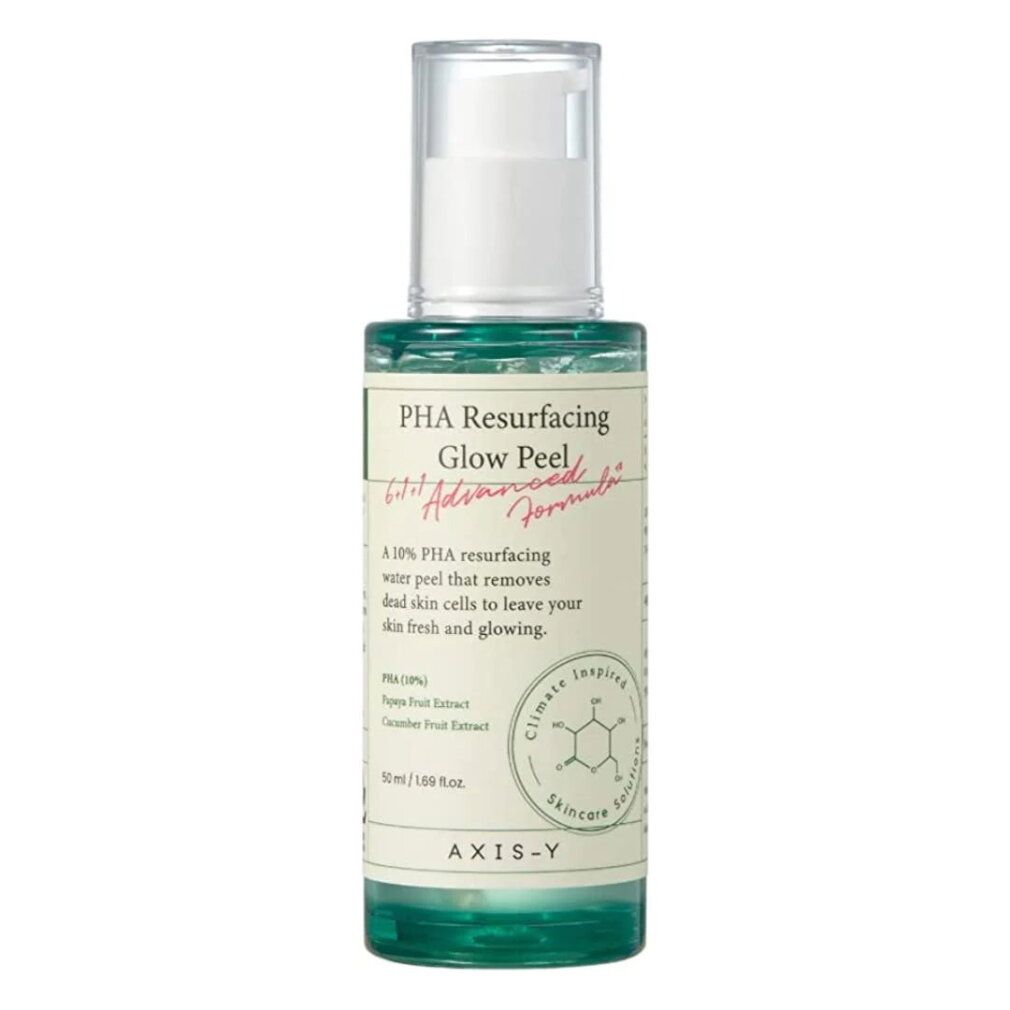 AXIS-Y PHA Resurfacing Glow Peel Flasche mit Pumpspender, auf einem Stück Papaya liegend.