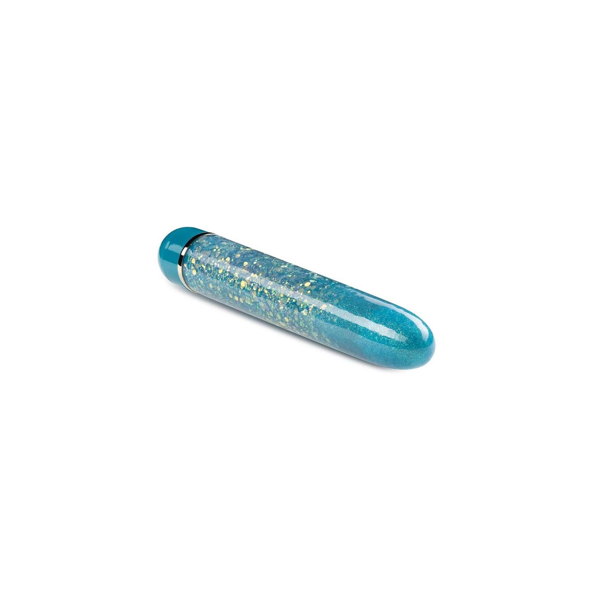 Zylindrisches Wellness-Produkt in Türkis mit Glitzer. Abgerundete Enden, Metallring am oberen Ende.