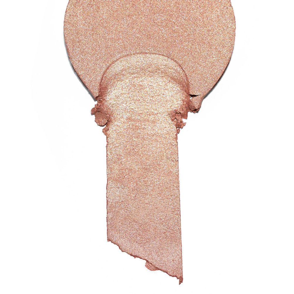 Highlighter-Abstrich in Form eines Tropfens. Goldfarbener Schimmer. Produkt von Essence.