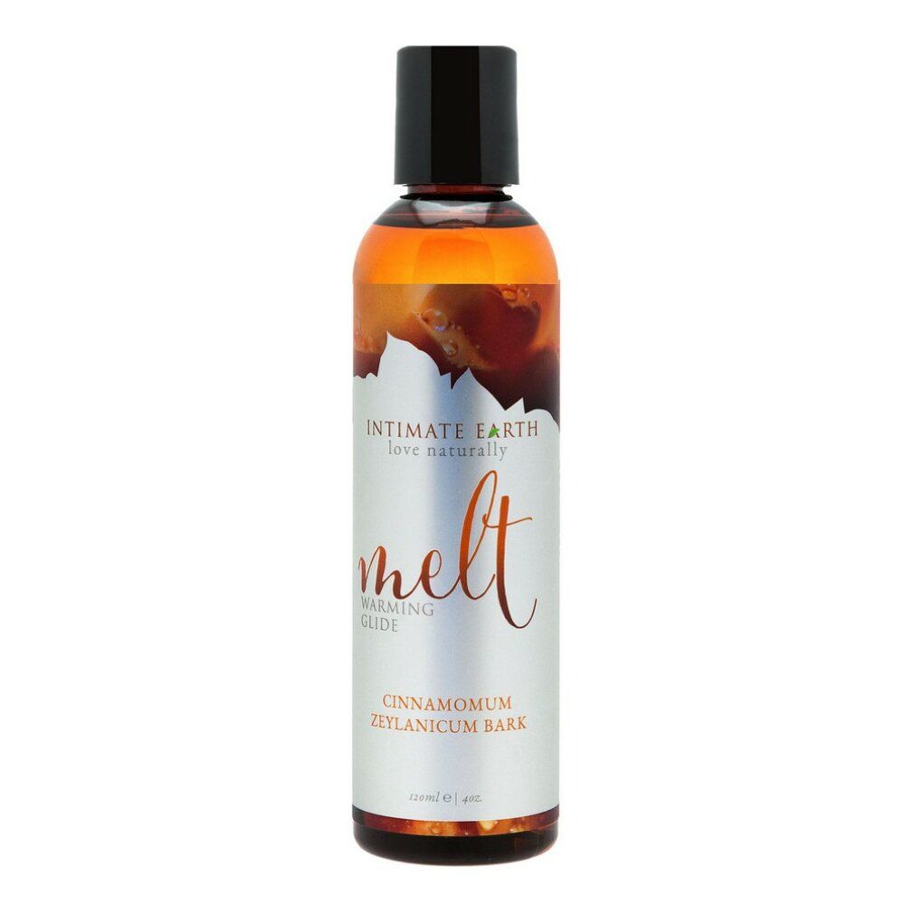 Liquido in bottiglia con tappo nero. Scritta: Intimate Earth, Melt, Warming Glide, Cinnamomum Zeylanicum Bark.
