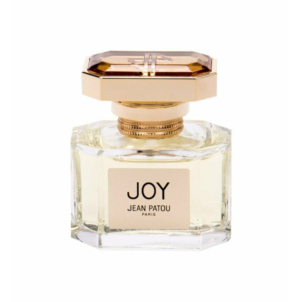 Parfümflakon mit goldfarbenem Verschluss und Etikett "JOY JEAN PATOU PARIS". Klarer Glasflakon mit goldfarbenen Details.