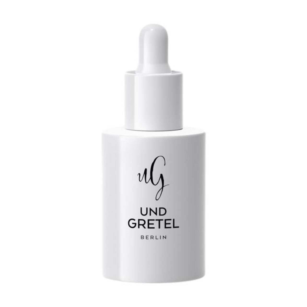 Weiße Flasche mit Tropfer. Aufschrift: UND GRETEL, BERLIN. Schwarze Schrift auf weißem Hintergrund.