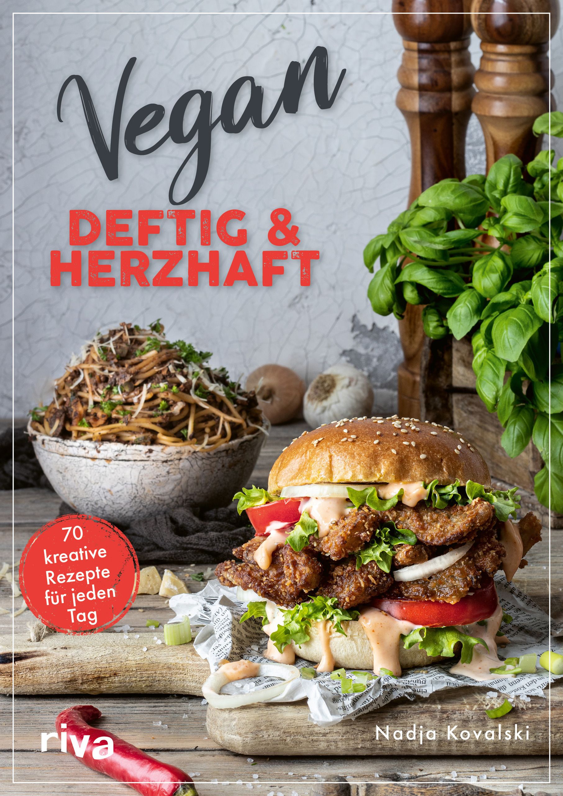 Buchcover: Vegan – deftig & herzhaft. Titel in Schwarz und Rot. Abgebildet sind ein Burger und Nudeln. Autorin: Nadja Kovalski.