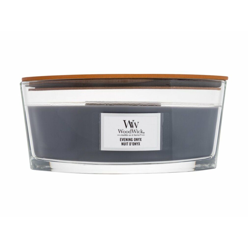Kerze mit Holzdeckel. Graues Wachs in Glasbehälter. Etikett mit 'WoodWick' und 'Evening Onyx'.