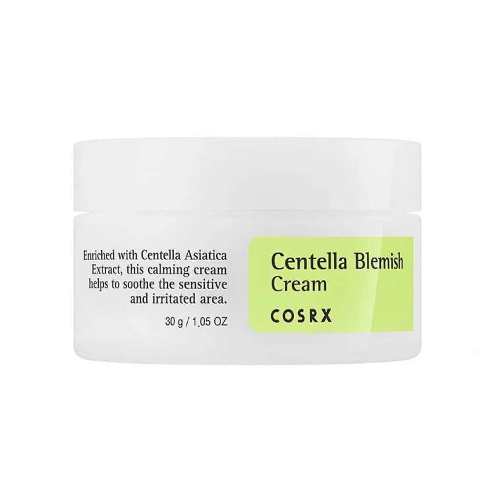 COSRX Centella Blemish Cream Tiegel mit Karton, auf grünem Untergrund.