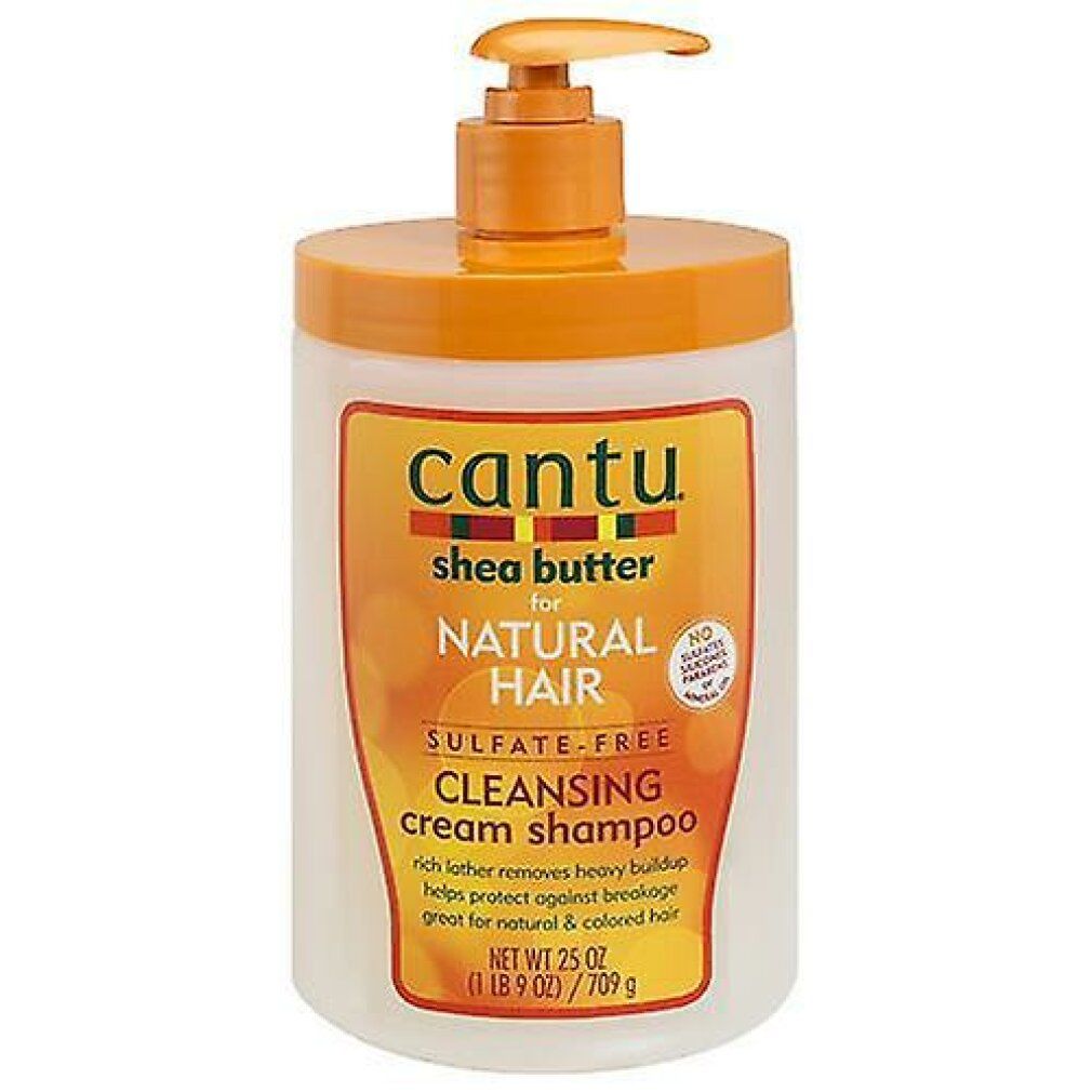 Shampoo-Flasche mit Pumpverschluss. Aufschrift: Cantu, Shea Butter, Natural Hair, Cleansing Cream Shampoo. Orange-weißes Design.