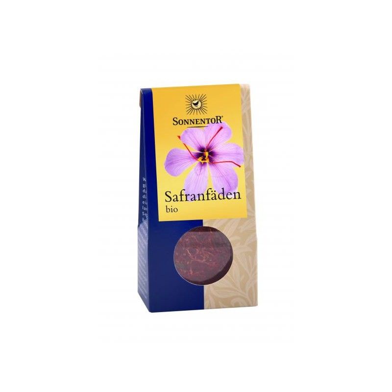 Verpackung mit Safranfäden. Auf gelbem Etikett: Sonnentor, lila Blüte, Safranfäden bio. Sichtfenster mit Safran.