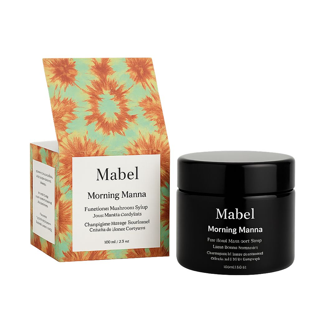 Schwarzes Glas mit weißer Aufschrift: Mabel, Morning Manna, neben einer geöffneten Schachtel. 100 ml / 3.5 oz.