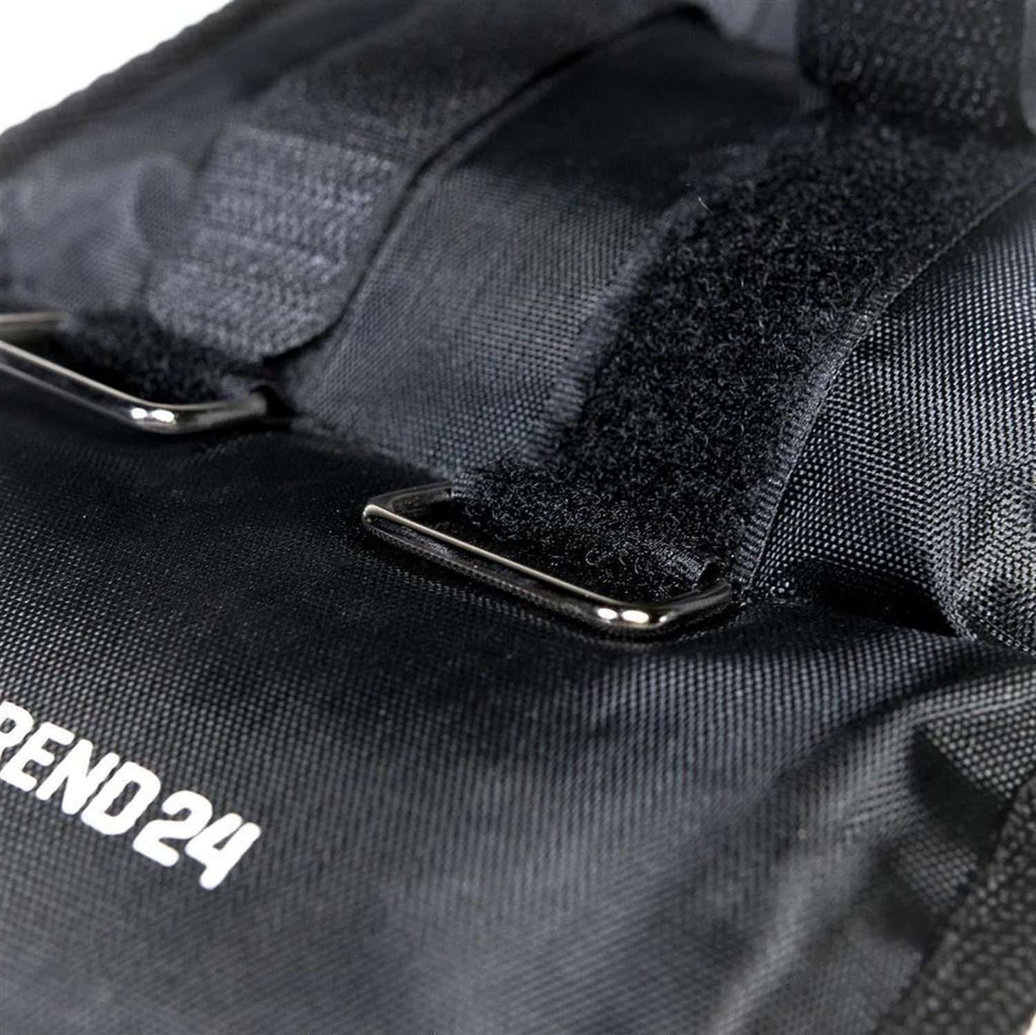 Schwarze Gewichtsmanschette mit Klettverschlüssen und Metallösen. Aufschrift: TREND 24.