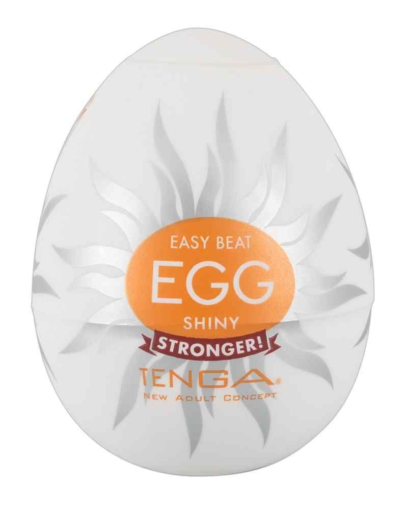 Weißes, eiförmiges Produkt. Auf der Verpackung steht "EASY BEAT EGG SHINY" und "TENGA".