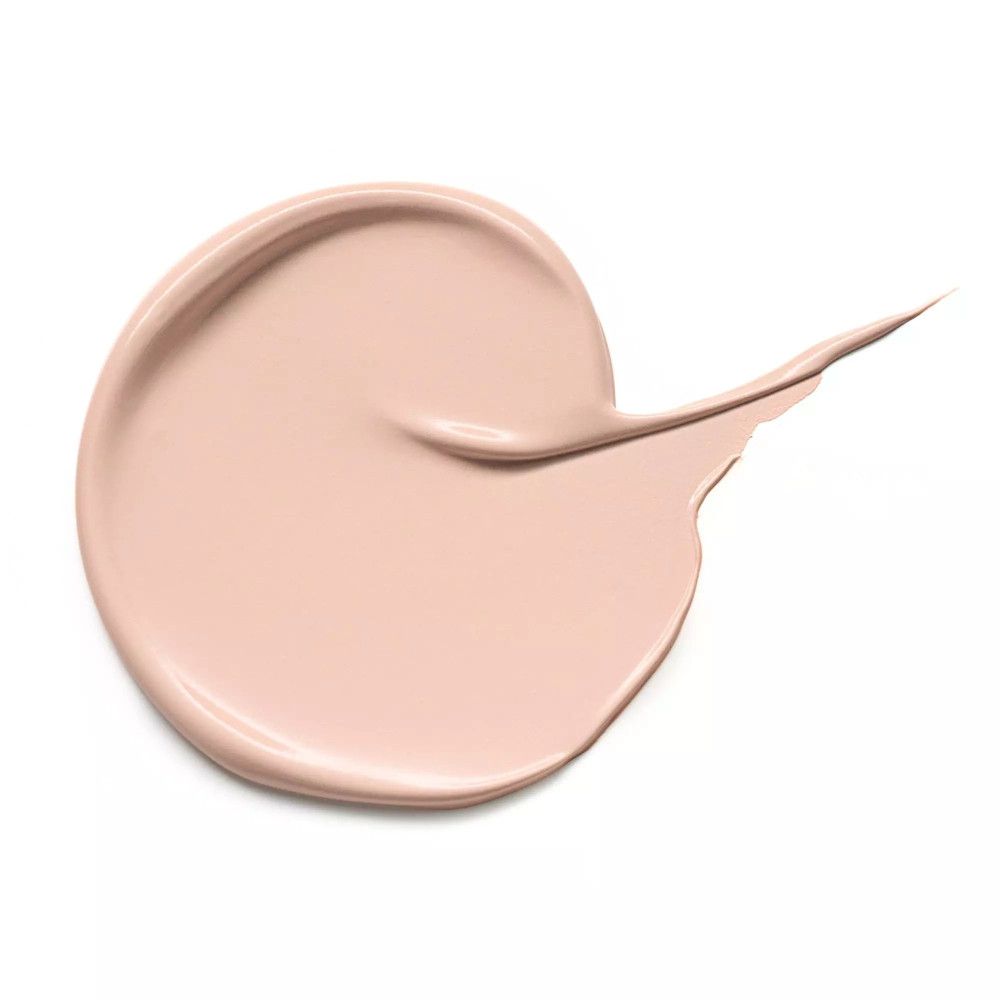 Beige Concealer-Probe, kreisförmig aufgetragen und mit einem Schwung versehen.