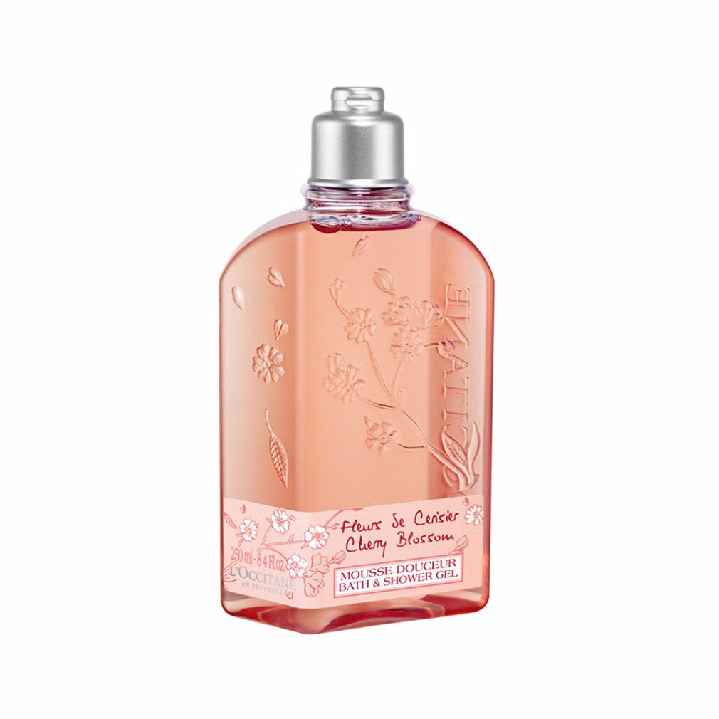 Rosa Duschgel-Flasche mit Kirschblüten-Design. Text: "Fleur de Cerisier Cherry Blossom". Marke sichtbar.