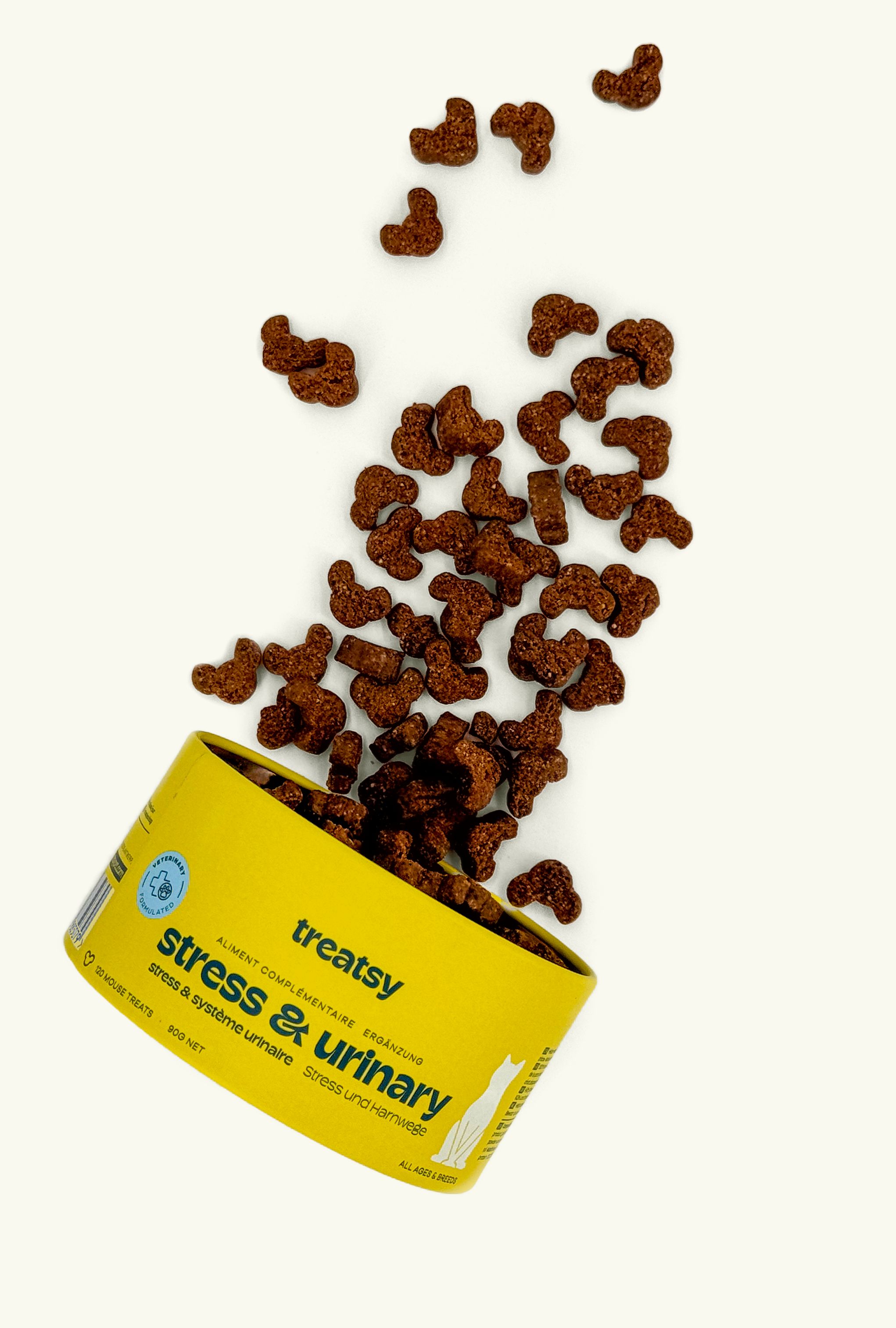 Gelbe Dose mit "treatsy stress & urinary". Braune, mausförmige Snacks fallen heraus.