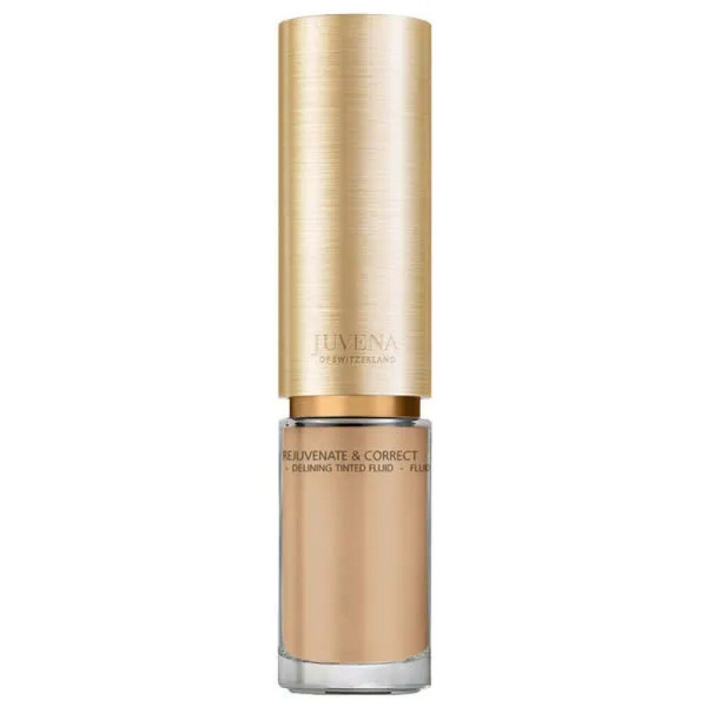 Flakon Juvena of Switzerland Delining Tinted Fluid SPF 10. Beige Flüssigkeit, goldener Deckel.