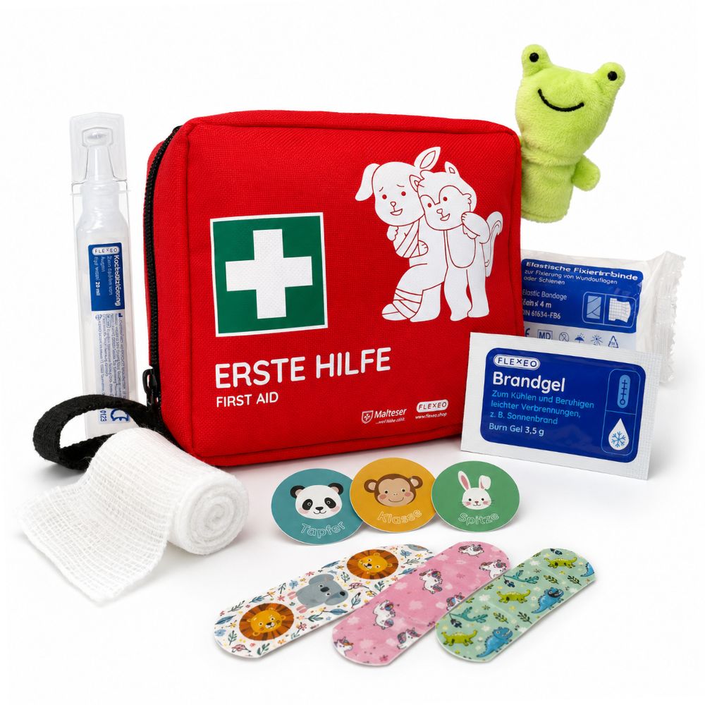 Rotes Erste-Hilfe-Set mit Tiermotiv, Augenspülung, Verband, Pflastern, Brandgel, Kühlkompresse und Kuscheltier. Erste Hilfe.
